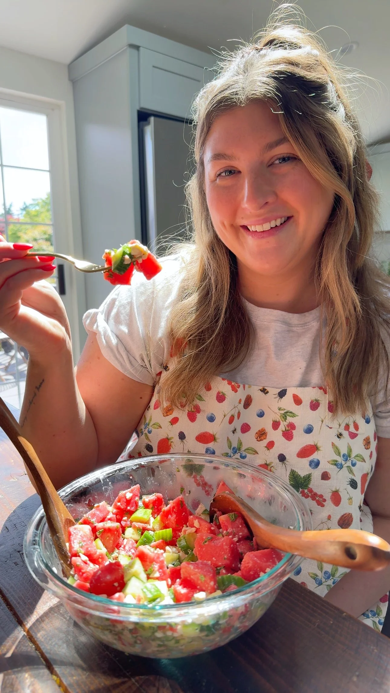 A serving bowl of watermelon, cucumber, fresh mint and feta cheese.