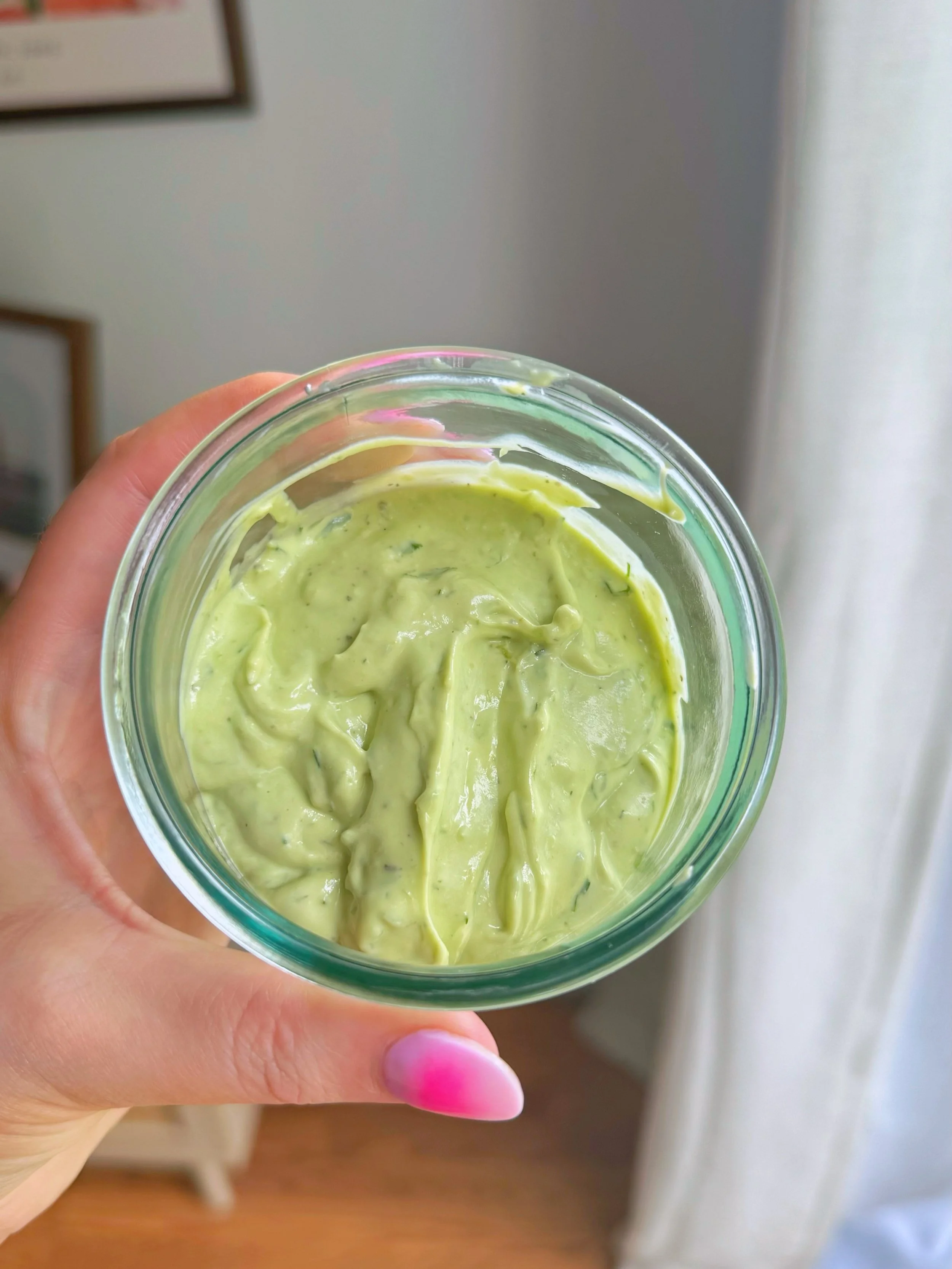 A dish with avocado salad dressing in it.