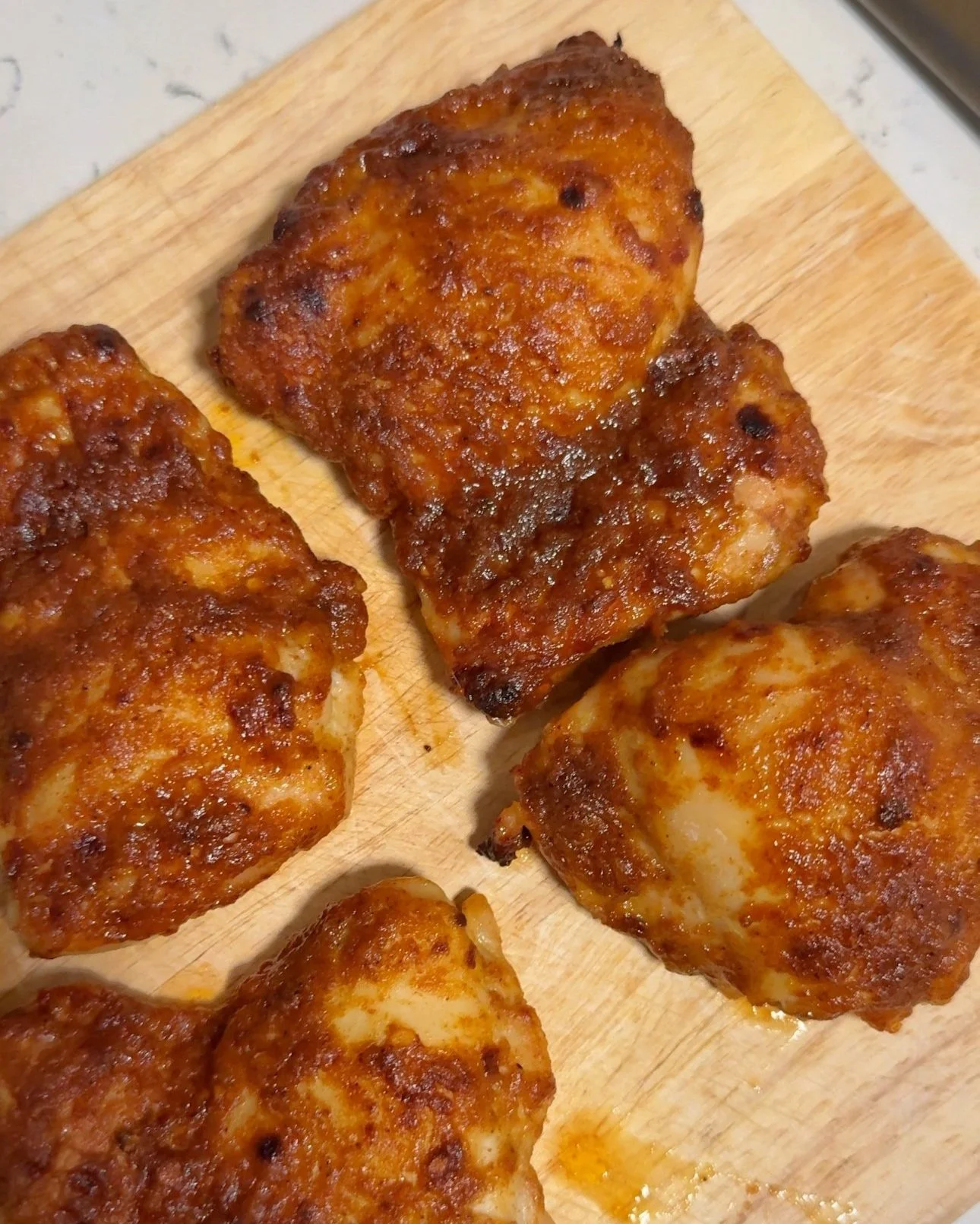 Honey mustard chicken on top of a cutting board.