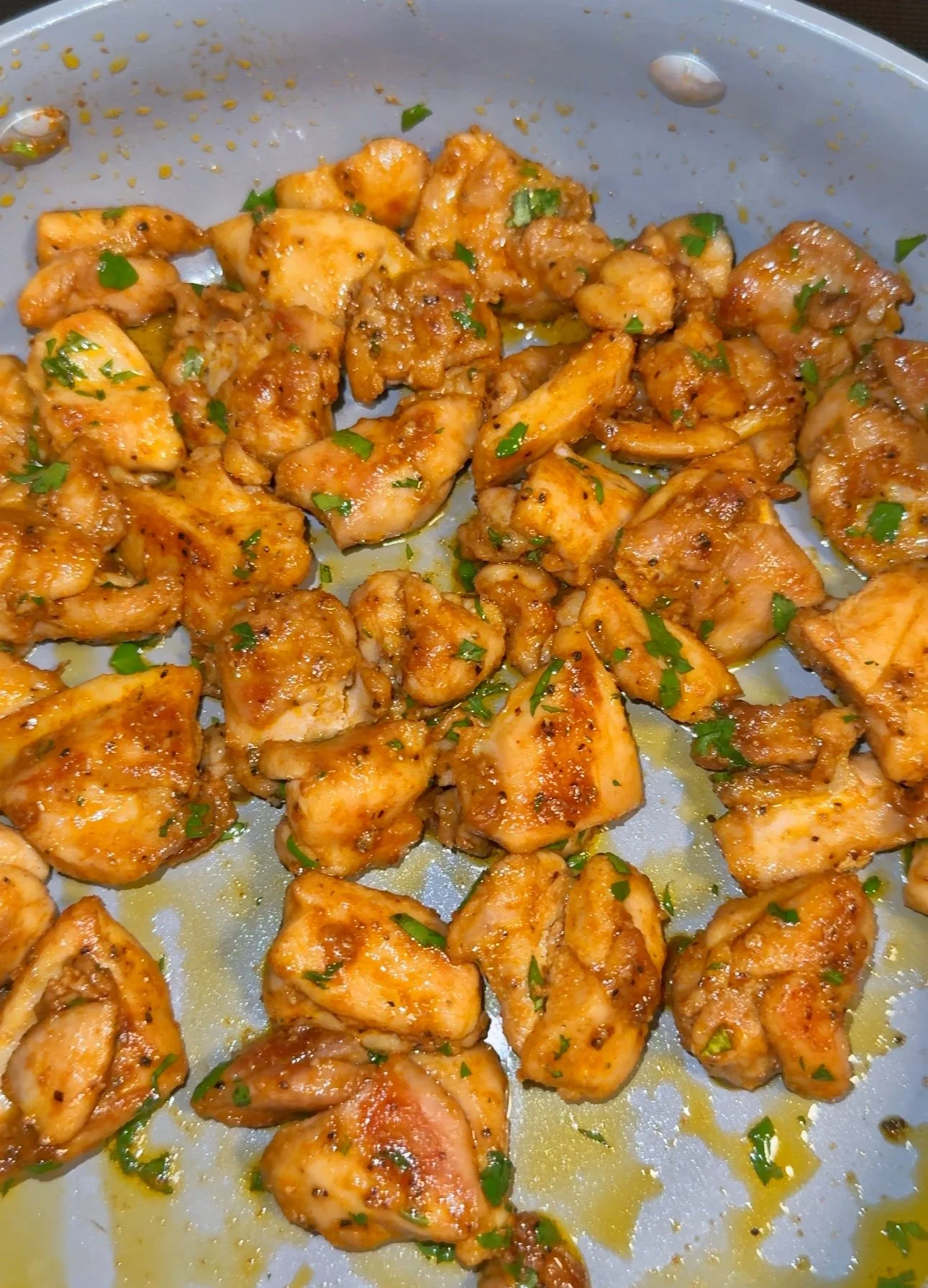 A pan of lime chicken with cilantro on top.