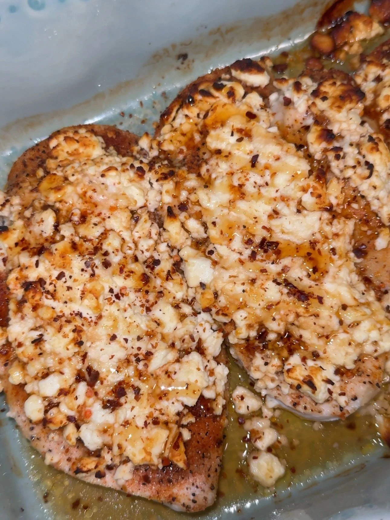 Feta & hot honey chicken bake in a baking dish.