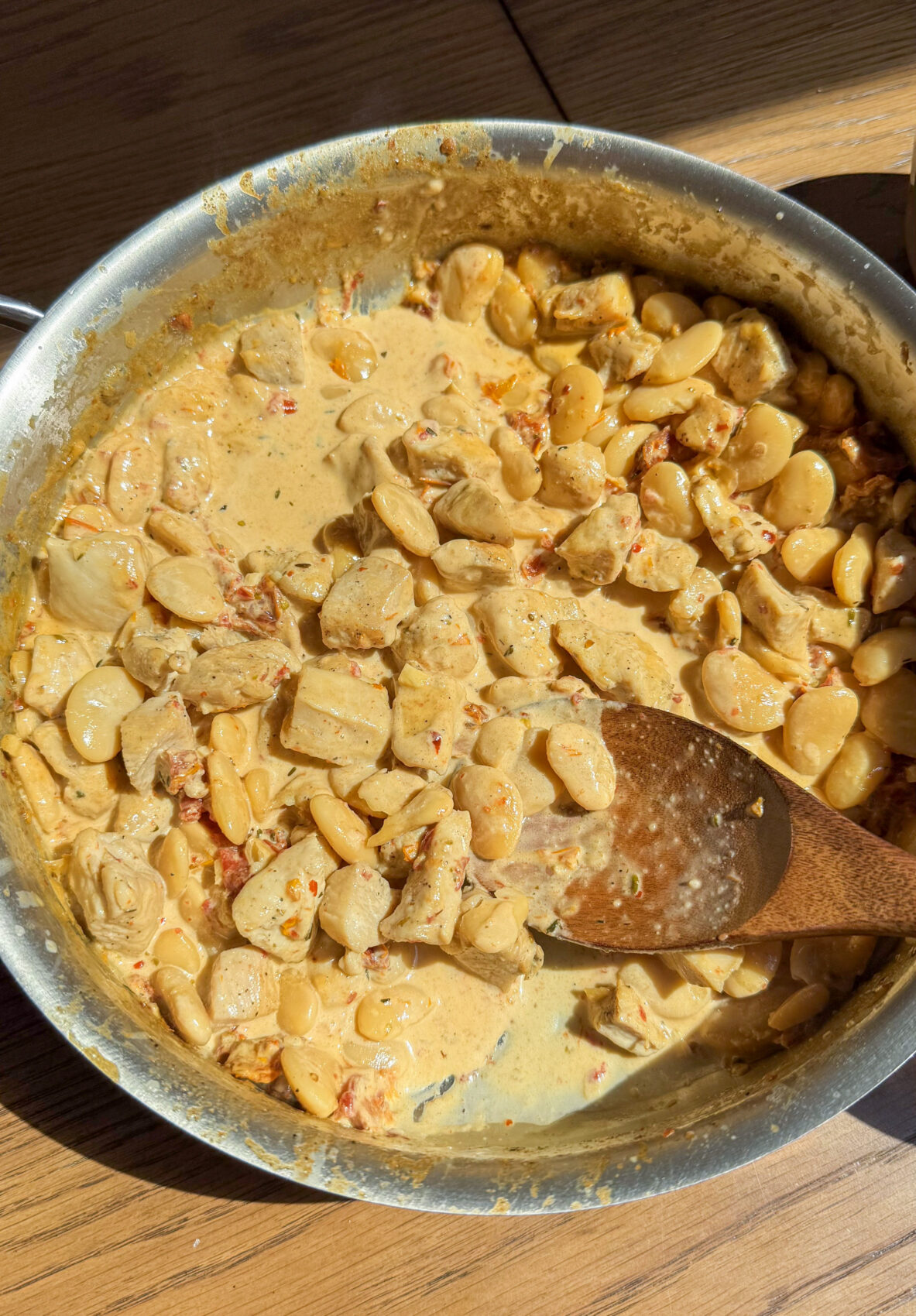 A golden, creamy Marry Me sauce coats tender chicken and hearty butter beans, garnished with fresh herbs and sun-dried tomatoes in this quick, one-pan meal.