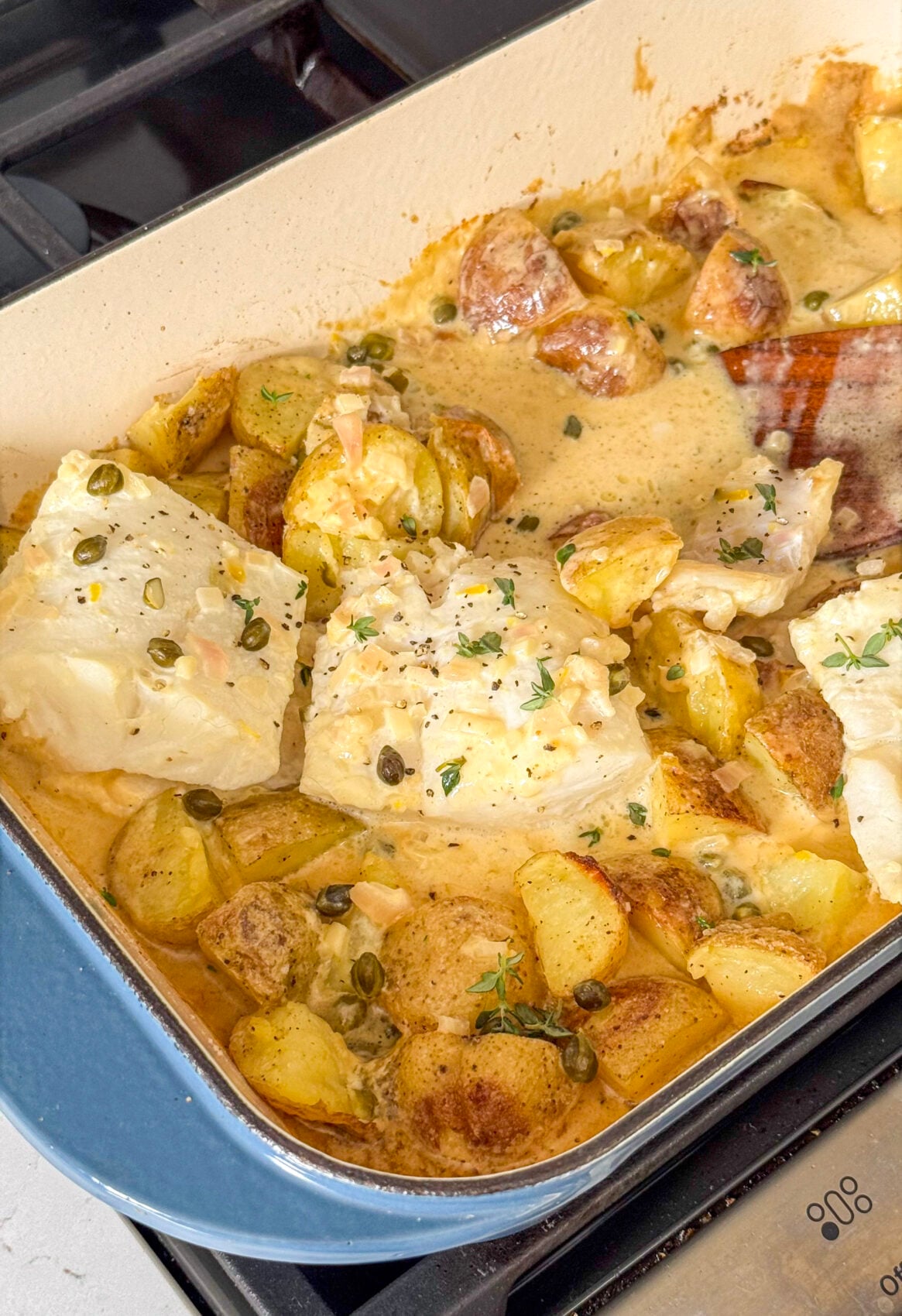 Baked Cod and Potatoes with Caper Lemon Cream Sauce
