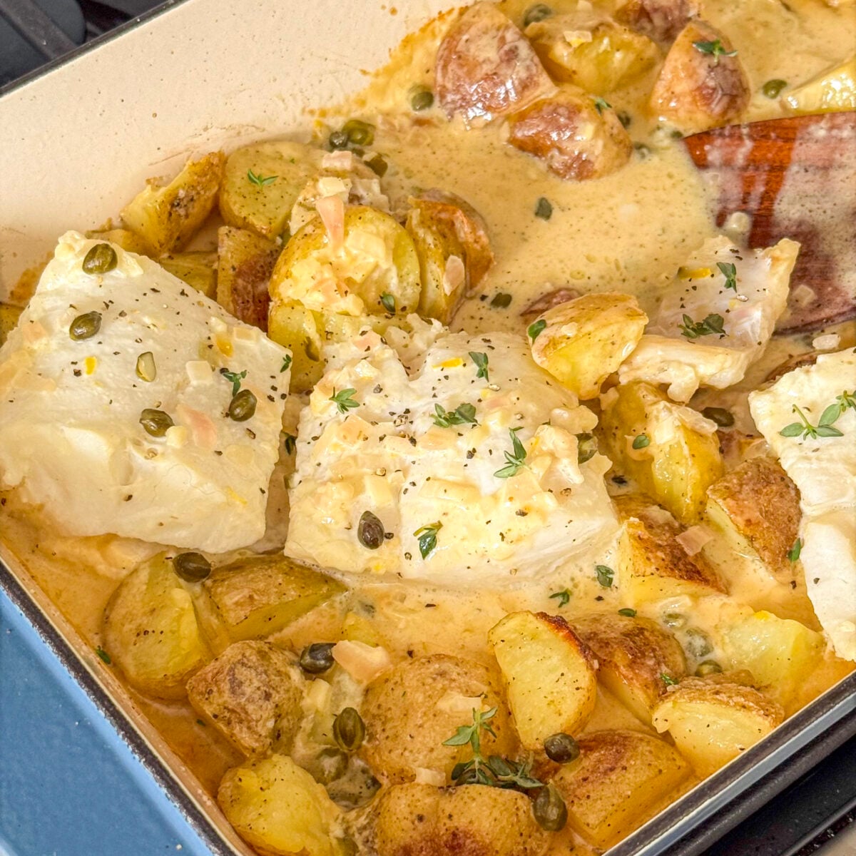 Baked Cod and Potatoes with Caper Lemon Cream Sauce